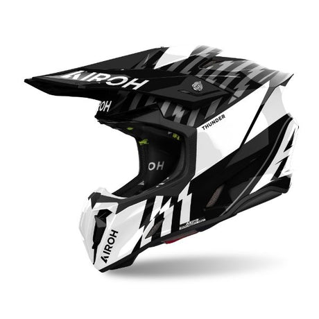 Airoh Twist 3 Thunder Black/White Gloss MX Helmet featuring a sleek, aerodynamic design with bold black and white graphics.