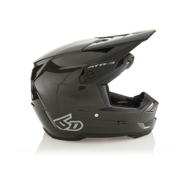 Glossy black ATR-3 Solid helmet with sleek design.